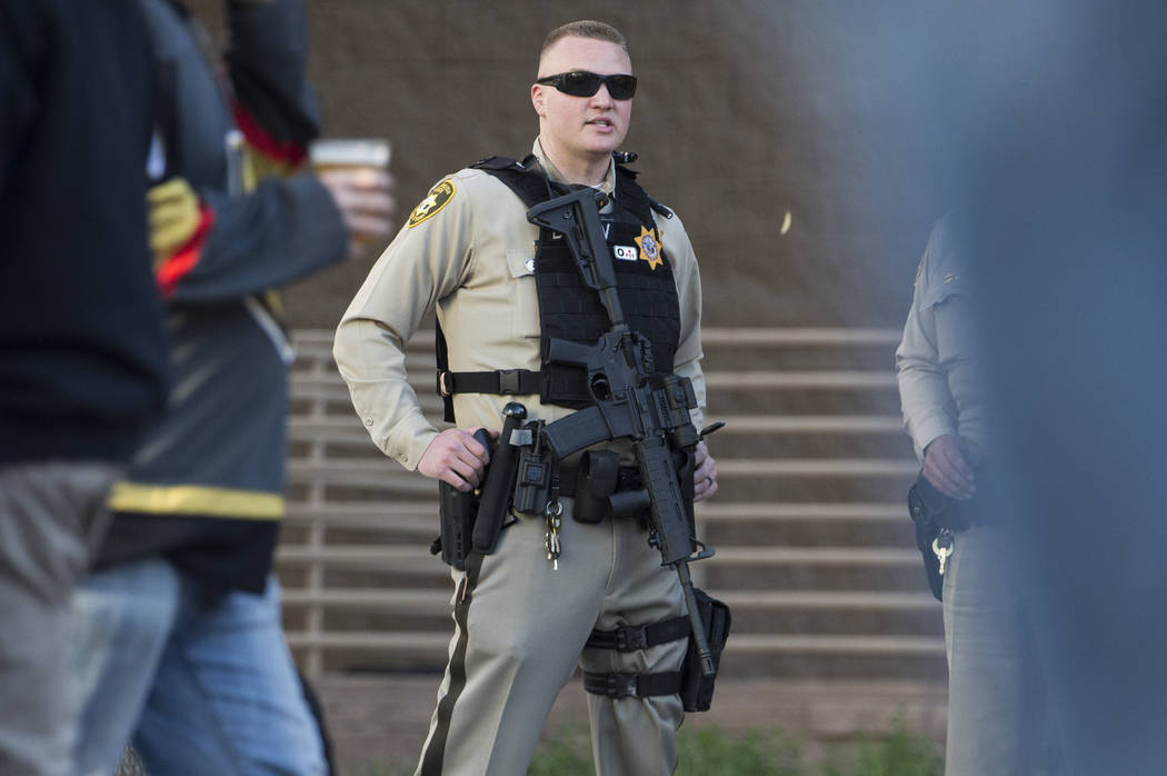 Metro officer Dallin Van Buskirk, armed with an AR-15 semi-automatic rifle with a scope, patrol ...