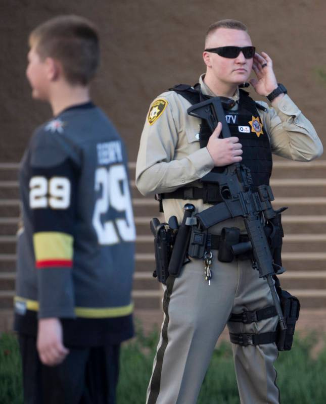 Metro officer Dallin Van Buskirk, armed with an AR-15 semi-automatic rifle with a scope, patrol ...