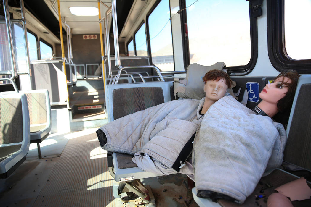 Dummies are seen inside a bus donated to the Metropolitan Police Department firearms range for ...