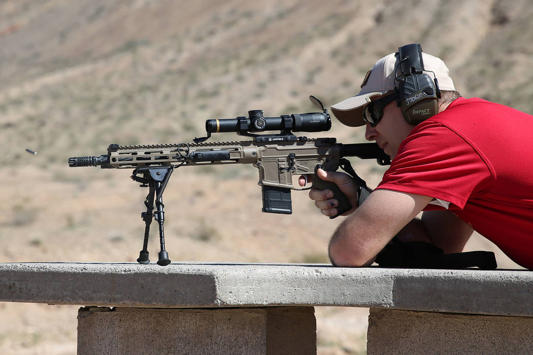 Las Vegas police Sgt. Shawn Romprey shoots his semi-automatic rifle at the Metropolitan Police ...
