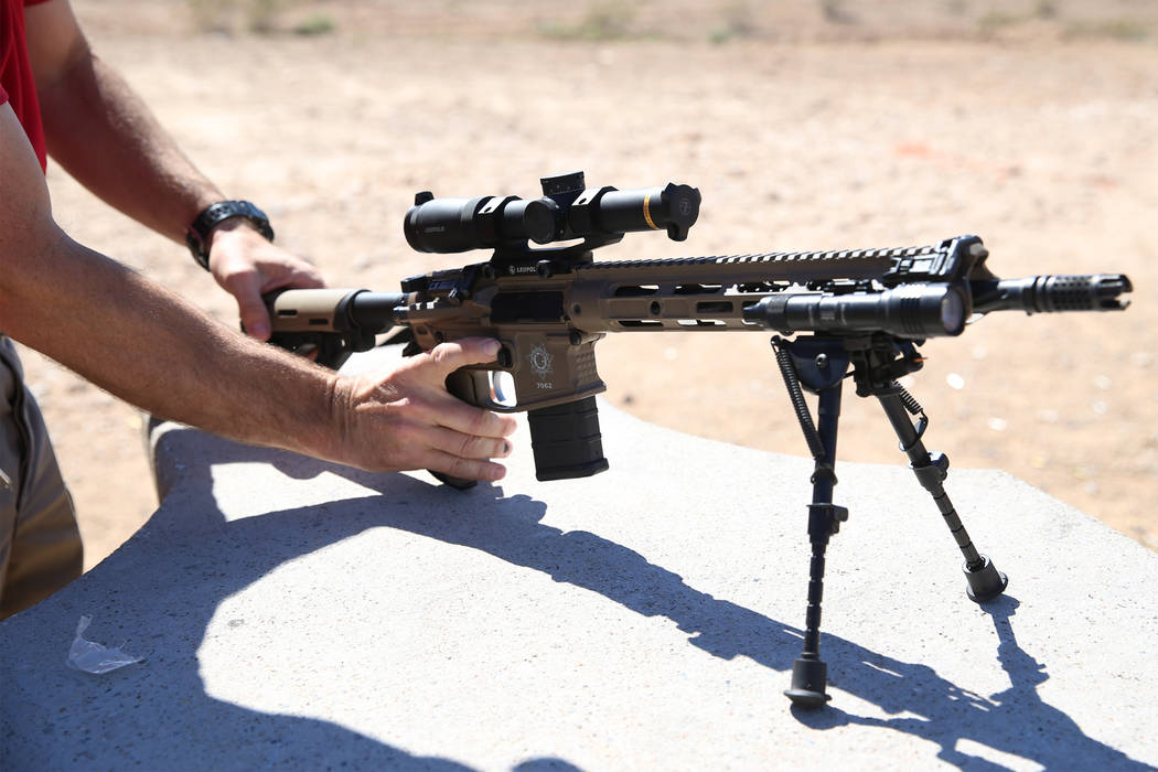Las Vegas police Sgt. Shawn Romprey prepares to shoot his semi-automatic rifle at the Metropoli ...