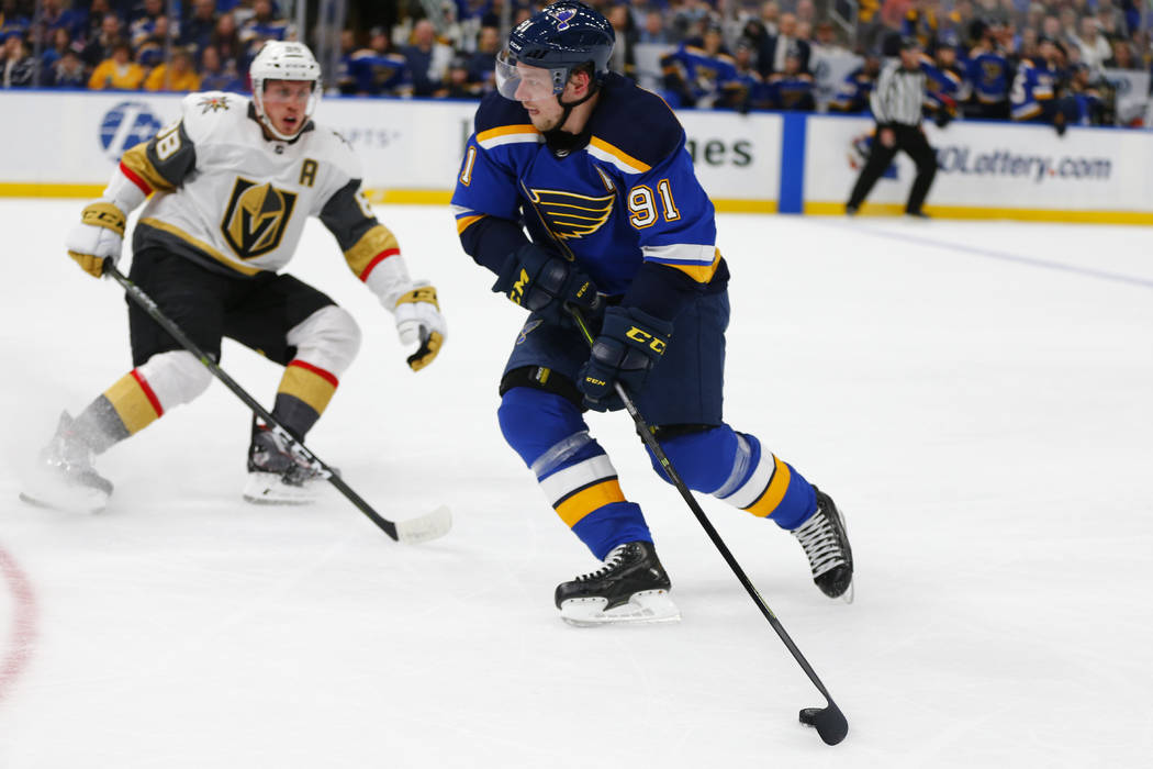 St. Louis Blues' Vladimir Tarasenko (91), of Russia, looks to pass the puck against the Vegas Golden Knights during the second period of an NHL hockey game Monday, March 25, 2019, in St. Louis. (A ...