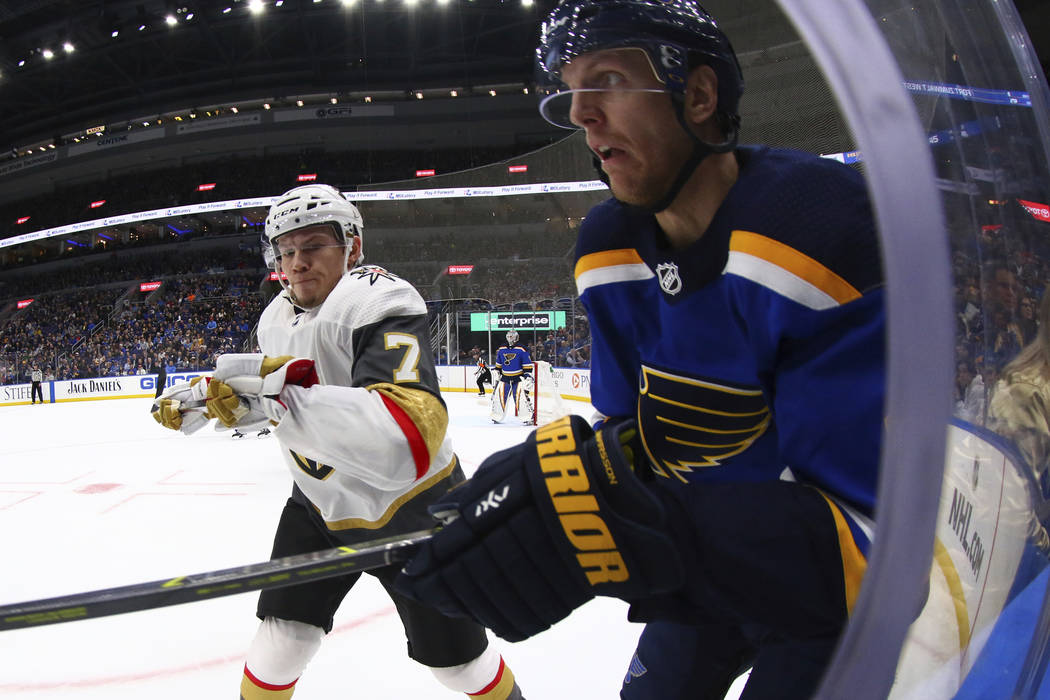 Vegas Golden Knights' Valentin Zykov (7), of Russia, sets up to check St. Louis Blues' Carl Gunnarsson (4), of Sweden, during the first period of an NHL hockey game Monday, March 25, 2019 in St. L ...