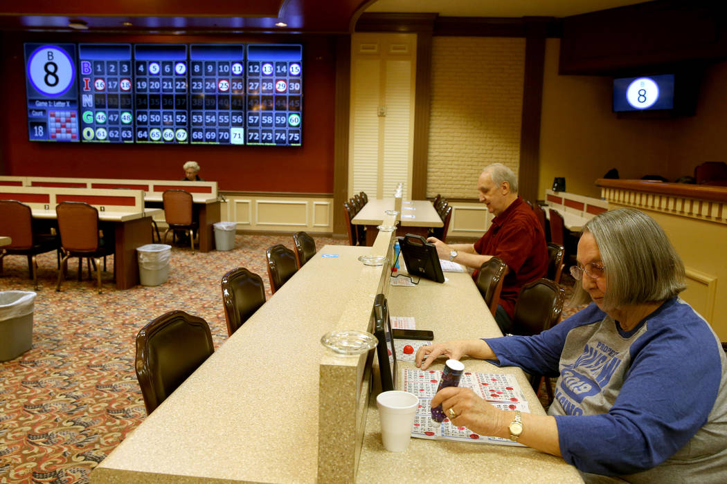 Jon Avery, 72, and his wife Barbara Avery, 70, of Las Vegas, play in the first bingo session of ...