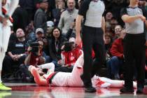 Portland Trail Blazers center Jusuf Nurkic, on ground, was injured and left the court on a stretcher as the Blazers beat the Brooklyn Nets in double overtime, 148-144, during an NBA basketball gam ...