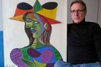 This image released on Tuesday March 26, 2019, shows Dutch art detective Arthur Brand with "Buste de Femme", a recovered Picasso painting. The painting was stolen from a wealthy Saudi's yacht 20 y ...