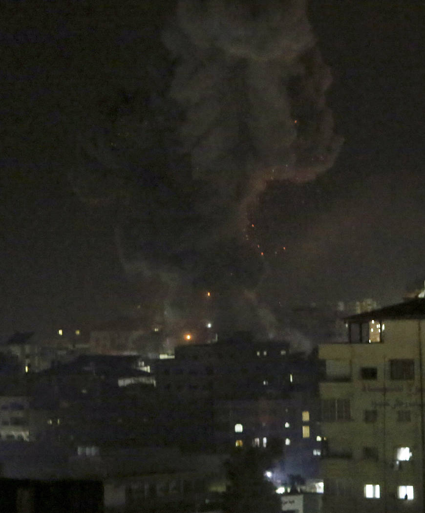 An explosion caused by Israeli airstrikes is seen in Gaza City, Monday, March 25, 2019. Israeli forces on Monday struck targets across the Gaza Strip in response to a surprise rocket attack from t ...