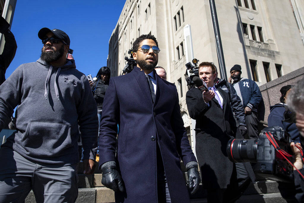 Actor Jussie Smollett leaves the Leighton Criminal Courthouse in Chicago on Tuesday March 26, 2019, after prosecutors dropped all charges against him. Smollett was indicted on 16 felony counts rel ...