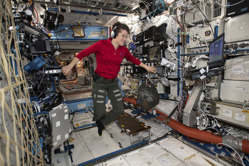 Flight Engineer Anne McClain looks at a laptop computer screen inside the U.S. Destiny laboratory module of the International Space Station on Jan. 18, 2019. McClain was supposed to participate in ...