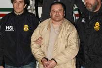 Authorities escort Joaquin "El Chapo" Guzman, center, from a plane to a waiting caravan of SUVs on Jan. 19, 2017, at Long Island MacArthur Airport in Ronkonkoma, N.Y. (United States Drug Enforceme ...