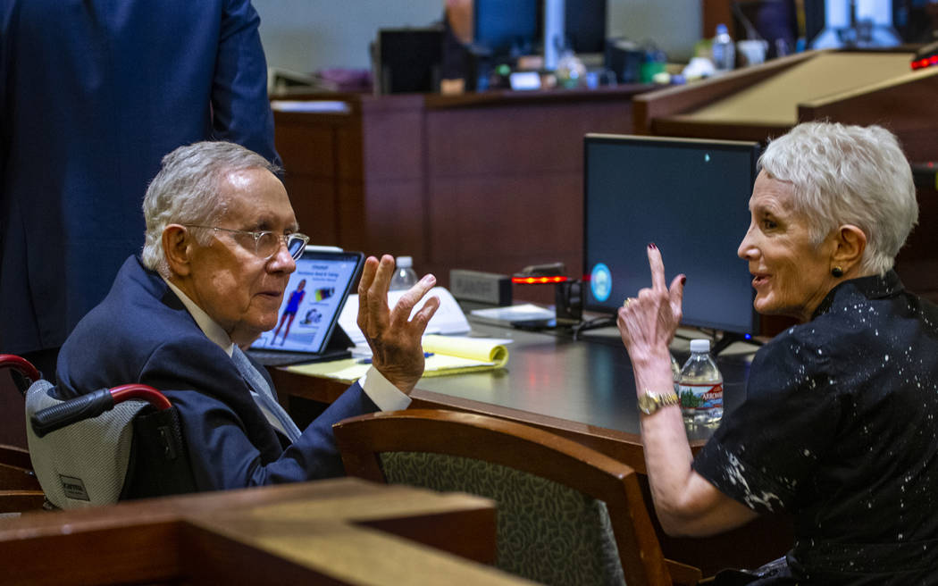 Former U.S. Sen. Harry Reid and wife Landra greet a friend in the gallery during Reid's civil trial against the makers of an exercise band at the Regional Justice Center on Tuesday, March 26, 2019 ...