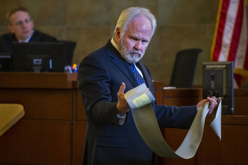 Jim Wilkes, attorney for former U.S. Sen. Harry Reid, displays a flexible exercise band during opening statements in a civil trial at the Regional Justice Center on Tuesday, March 26, 2019, in Las ...
