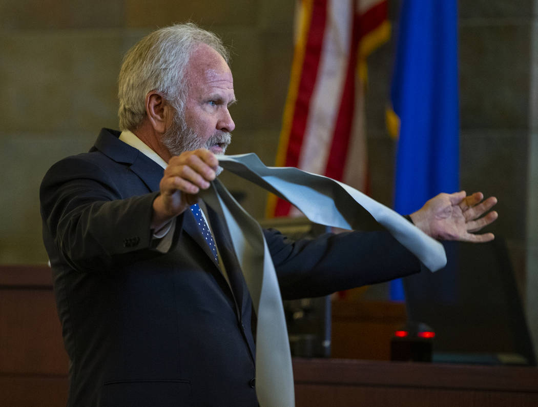 Jim Wilkes, attorney for former U.S. Sen. Harry Reid, displays a flexible exercise band during opening statements in a civil trial at the Regional Justice Center on Tuesday, March 26, 2019, in Las ...