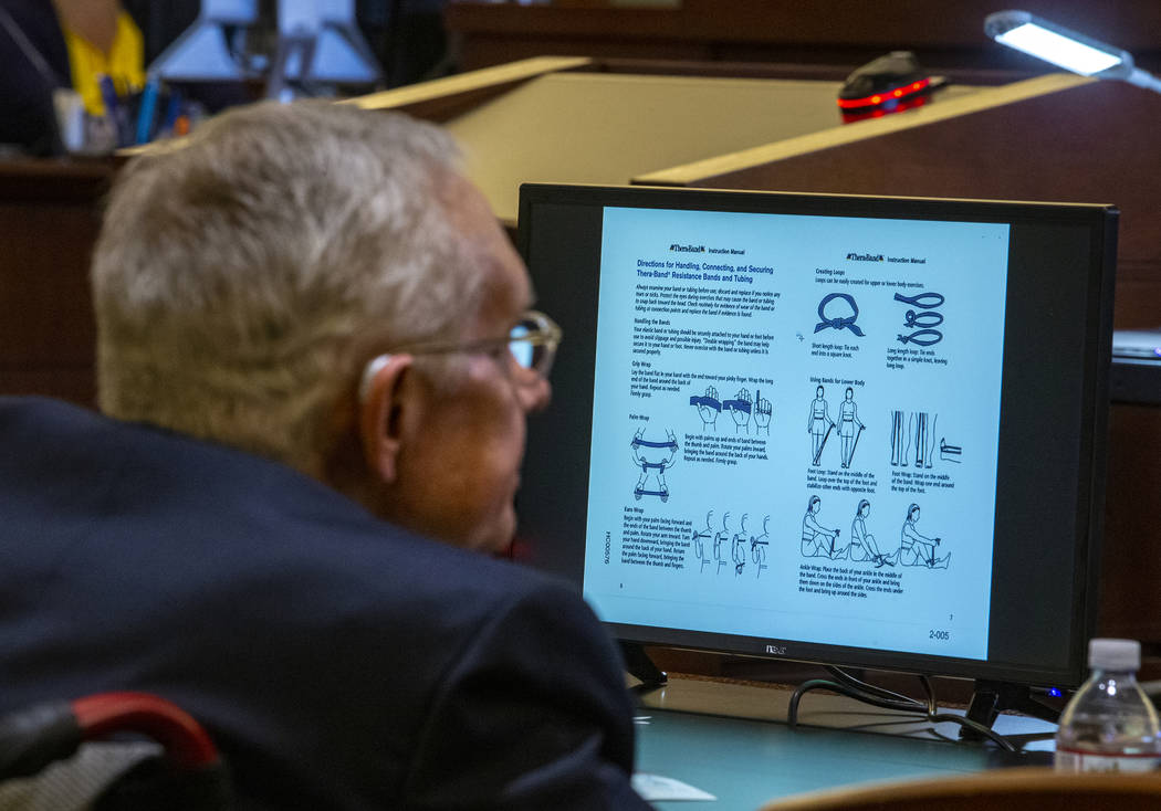 Former U.S. Sen. Harry Reid listens to opening statements during his civil trial against the makers of an exercise band at the Regional Justice Center on Tuesday, March 26, 2019, in Las Vegas. A g ...