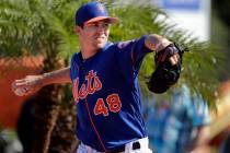 New York Mets pitcher Jacob deGrom throws a bullpen session during spring training baseball practice Thursday, Feb. 14, 2019, in Port St. Lucie, Fla. (AP Photo/Jeff Roberson)