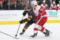 Vegas Golden Knights center Paul Stastny (26) shoots the puck for a miss under pressure from Detroit Red Wings center Dylan Larkin (71) during the first period of an NHL hockey game at T-Mobile Ar ...