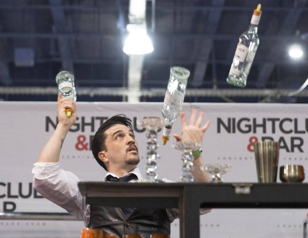 Luis Ortiz performs in the flair bartending competition at the Nightclub and Bar Show on Tuesday, March 26, 2019, at the Las Vegas Convention Center, in Las Vegas. (Benjamin Hager Review-Journal) ...