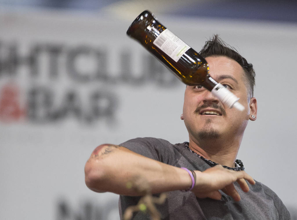 Michael Guzman performs in the flair bartending competition at the Nightclub and Bar Show on Tuesday, March 26, 2019, at the Las Vegas Convention Center, in Las Vegas. (Benjamin Hager Review-Journ ...