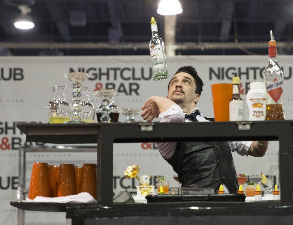 Luis Ortiz performs in the flair bartending competition at the Nightclub and Bar Show on Tuesday, March 26, 2019, at the Las Vegas Convention Center, in Las Vegas. (Benjamin Hager Review-Journal) ...