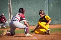 Bonanza shortstop Yankiel Gonzalez (24) slides into home plate as Cimarron-Memorial catcher Will Zadrowski (8) catches the ball to get him out during a baseball game at Bonanza High School in Las ...