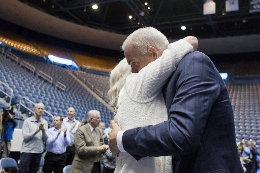 BYU men's basketball head coach Dave Rose hugs his wife, Cheryl, after finishing a press conference at the Marriott Center on Tuesday, March 26, 2019, in Provo, Utah. Rose announced his retirement ...