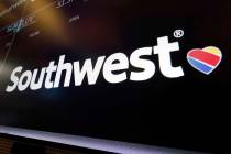 In this Monday, March 18, 2019, file photo, the logo for Southwest Airlines appears above a trading post on the floor of the New York Stock Exchange. The Federal Aviation Administration says a Sou ...
