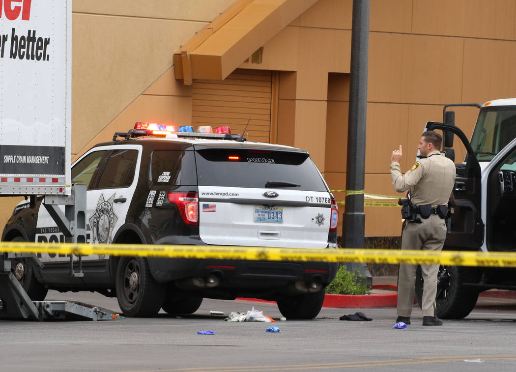 Las Vegas police investigate after a pursuit related to an officer-involved shooting ended at t ...