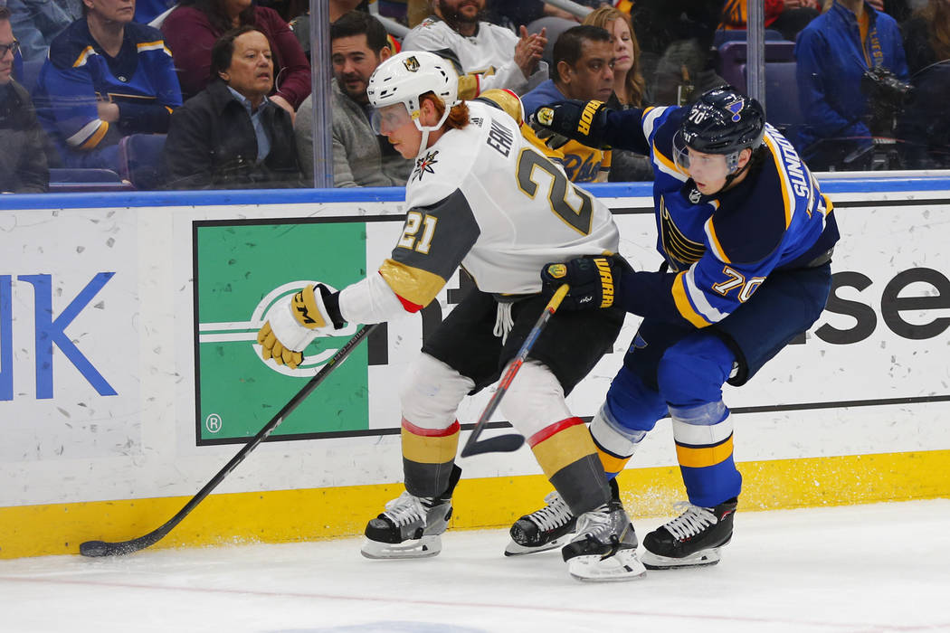 Vegas Golden Knights' Cody Eakin (21) beats St. Louis Blues' Oskar Sundqvist (70), of Sweden, t ...