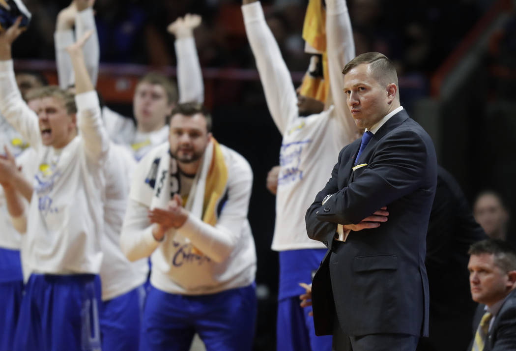 South Dakota State head coach T.J. Otzelberger, front right, watches from the bench during the ...