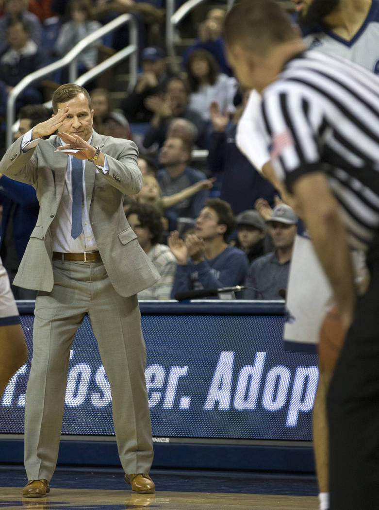 South Dakota State State head coach T.J. Otzelberger calls for a timeout in the second half of an NCAA college basketball game against Nevada in Reno, Nev., Saturday, Dec. 15, 2018. (AP Photo/Tom ...