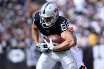 Oakland Raiders wide receiver Jordy Nelson (82) tries to break a tackle from Cleveland Browns defensive back T.J. Carrie (38) during the first half of their NFL game in Oakland, Calif., Sunday, Se ...