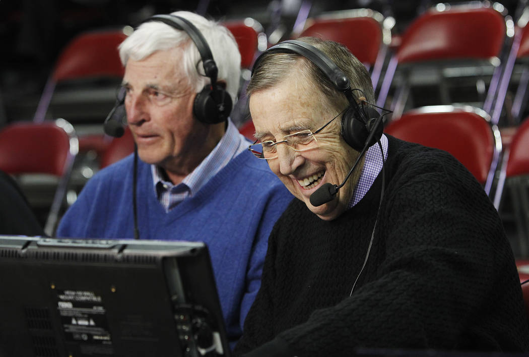 ESPN commentators Brent Musburger, right, and Bobby Knight prepare to call the game between UNL ...