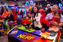 Hwa Yeon Lee with husband James and daughter Vivian, 2, with FunXcess enjoy a turn on the Nerf ...
