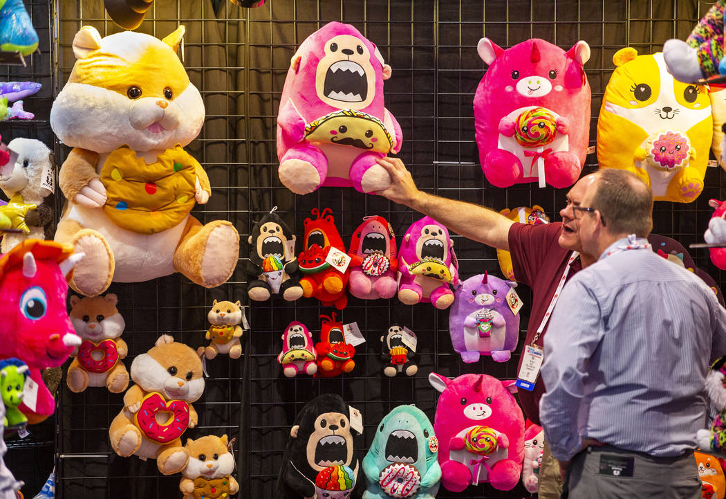 Bob Souza with Peek-A-Boo Toys shows off his stuffed animals during the the Amusement Expo at t ...