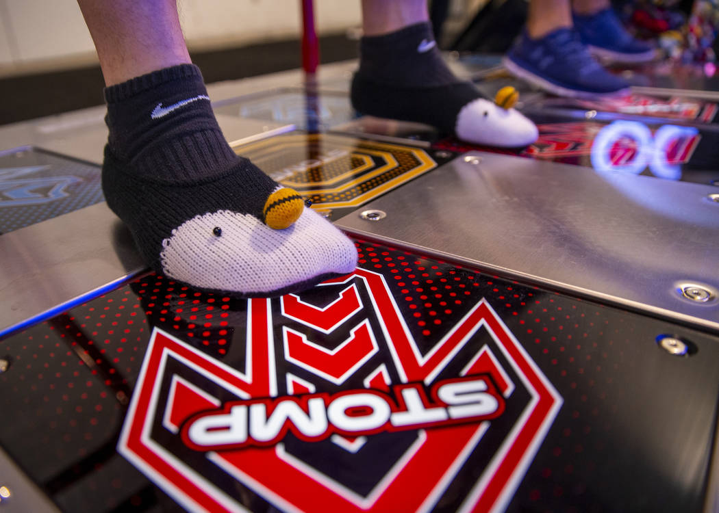 Michael Alvarado with XERO steps forward wearing penguin socks while paying Pump It Up during t ...