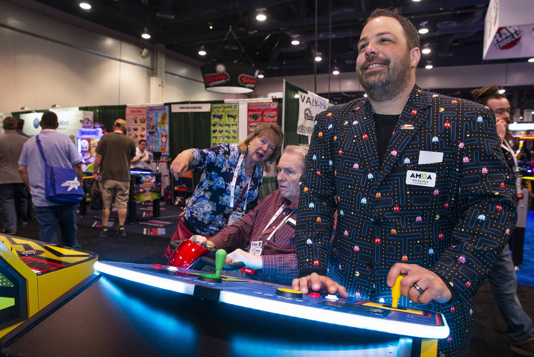 Bob Burnham with Paradise Pinball and Amusement LLC wears his Pacman suit while playing a giant ...