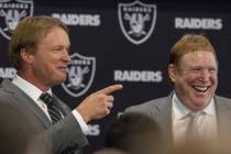 Jon Gruden, left, is announced as the head coach of the Oakland Raiders with owner Mark Davis a ...