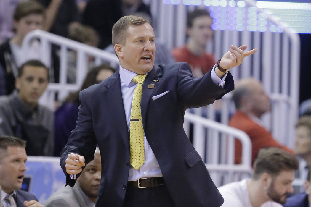 South Dakota State head coach T.J. Otzelberger shouts to his team during the first half of a fi ...