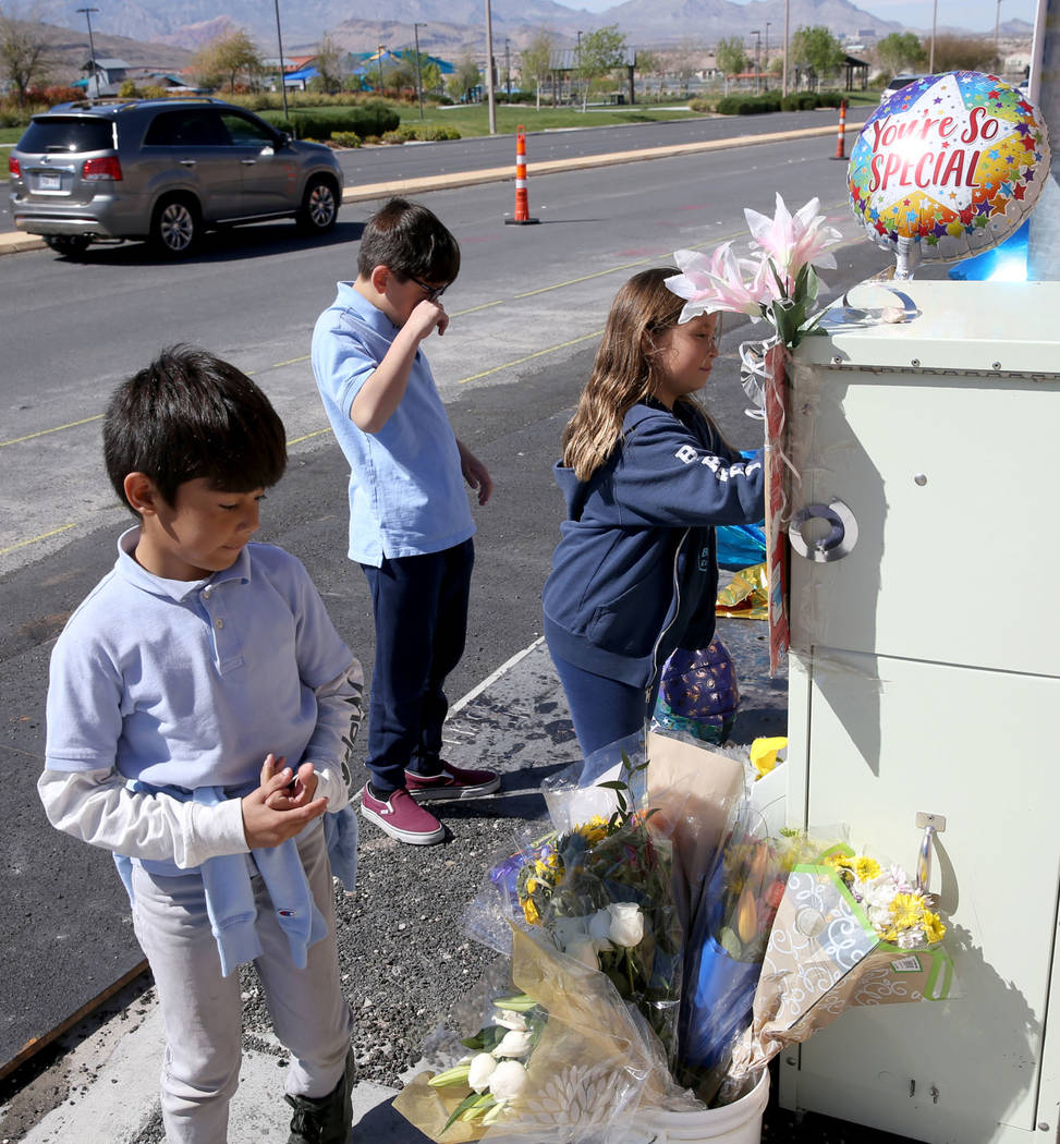 Leo Yoshimori, 9, from left, and his siblings, Talan, 11, and Evelyn, 7, visit a memorial on So ...