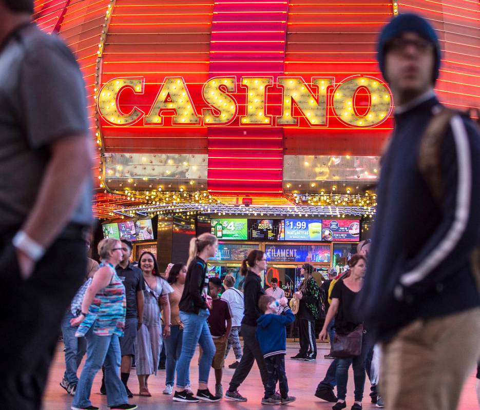 Fremont Street is packed with visitors on Thursday, March 28, 2019, in Las Vegas. (Benjamin Hag ...