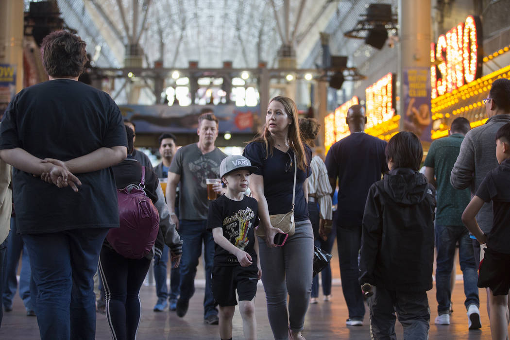 Fremont Street is packed with visitors on Thursday, March 28, 2019, in Las Vegas. (Benjamin Hag ...