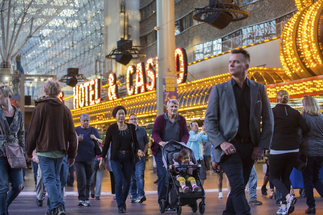 Fremont Street is packed with visitors on Thursday, March 28, 2019, in Las Vegas. (Benjamin Hag ...