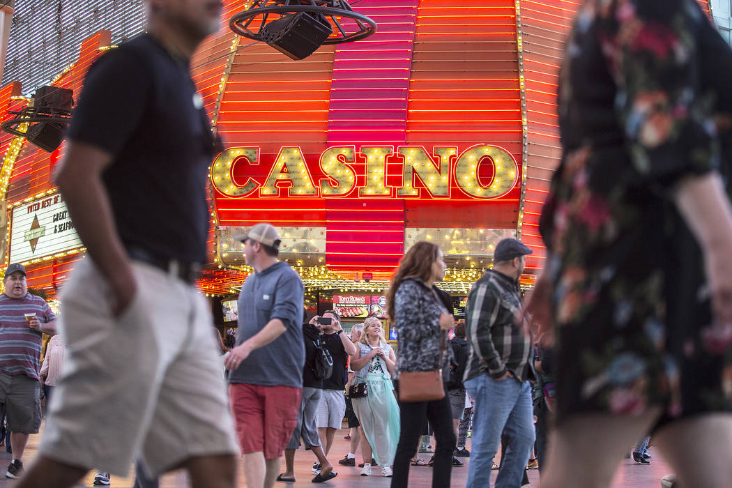 Fremont Street is packed with visitors on Thursday, March 28, 2019, in Las Vegas. (Benjamin Hag ...