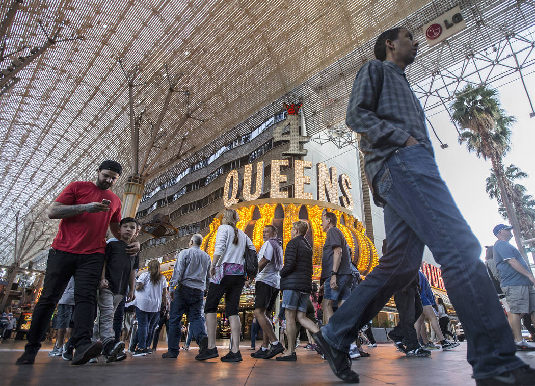 Fremont Street is packed with visitors on Thursday, March 28, 2019, in Las Vegas. (Benjamin Hag ...