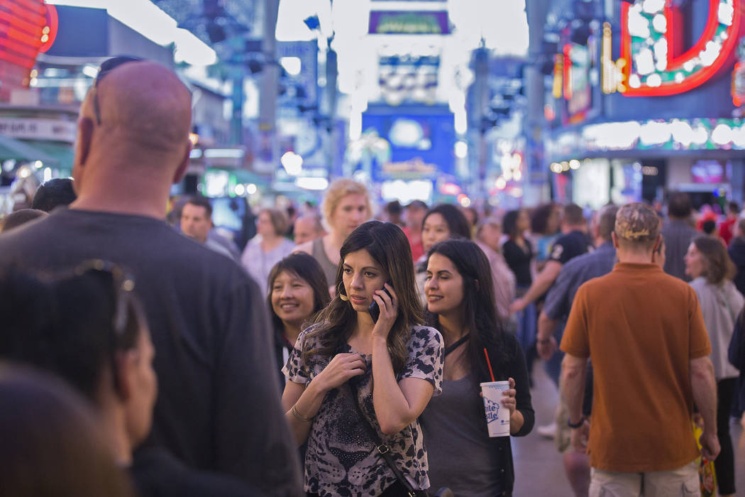 Fremont Street is packed with visitors on Thursday, March 28, 2019, in Las Vegas. (Benjamin Hag ...