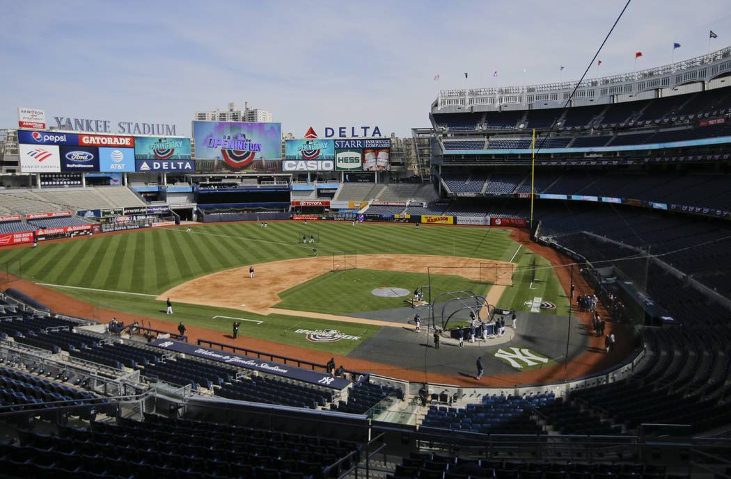 New York Yankees players take part in batting practice during a workout Wednesday, March 27, 20 ...