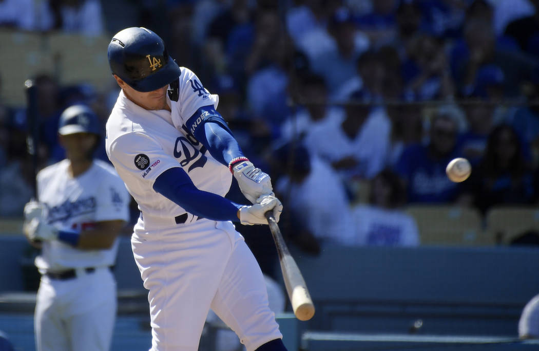 Los Angeles Dodgers' Enrique Hernandez hits a solo home run during the seventh inning of a base ...