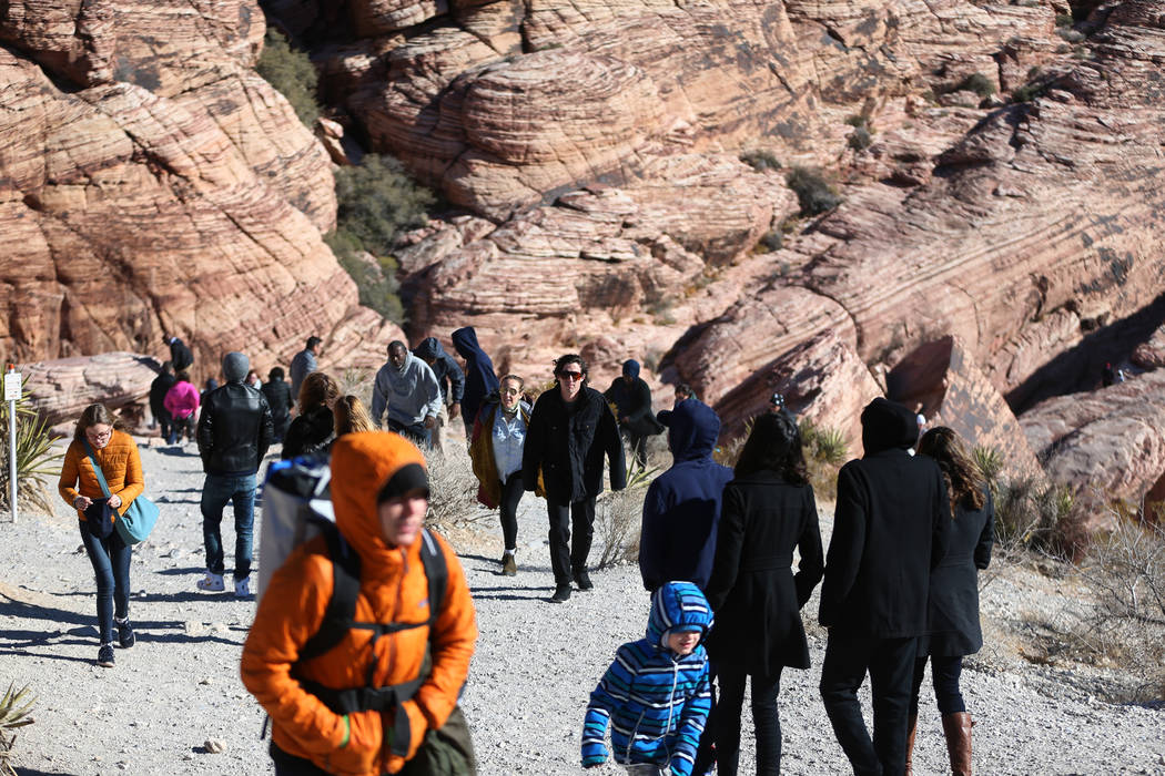 People visit the Red Rock Canyon scenic drive in Las Vegas, Tuesday, Jan. 1, 2019. Erik Verduzc ...