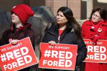 Alec Miller, left, Alicia Norman and Jana Pleggenkuhle demonstrate their support for the ''Red ...