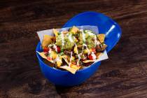 Crunch Time Carne Asada Nachos served in a baseball cap will be available at concessions stands ...